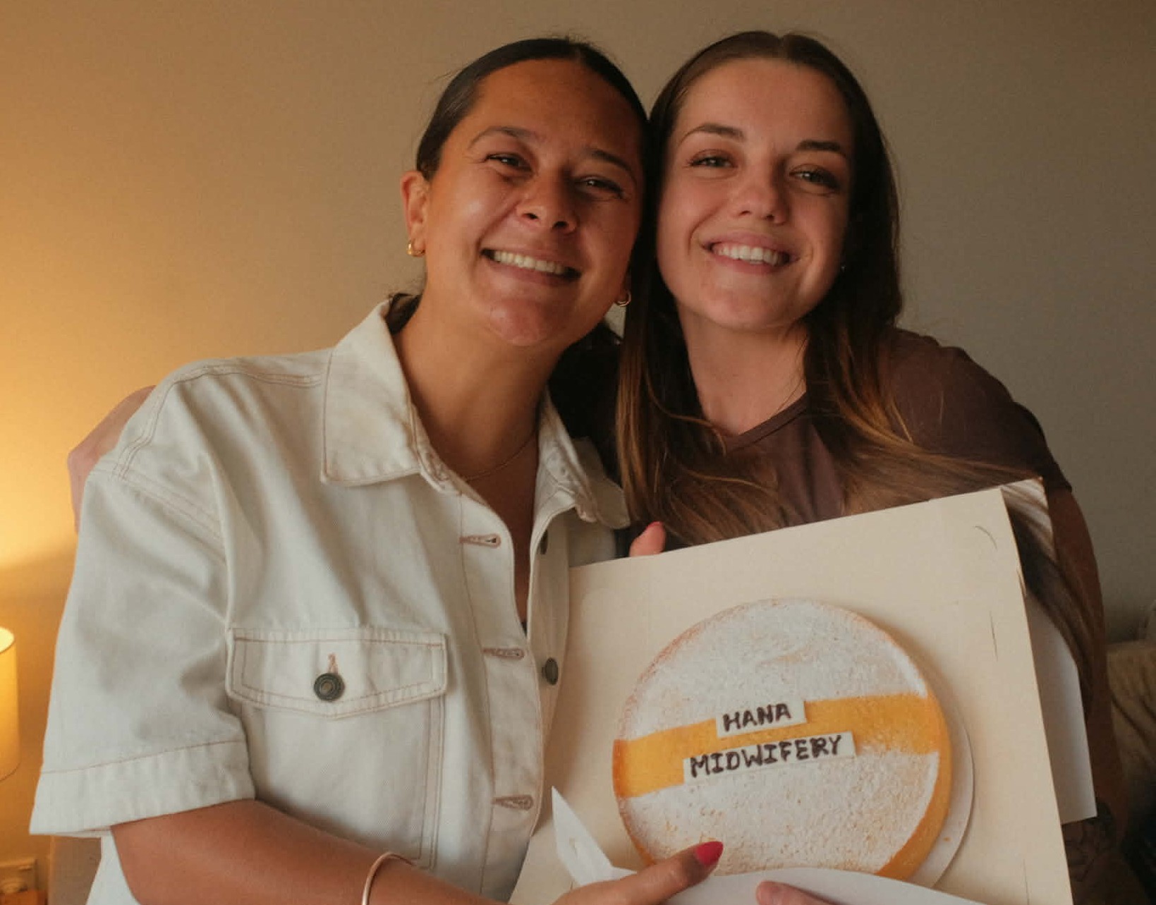 Ana and Harriet, the midwives of Hana Midwifery, celebrating together